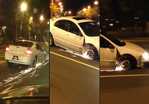 HD Mulher conduz carro sem pneu.jpg