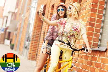 40532761-a-picture-of-two-girl-friends-riding-a-ta